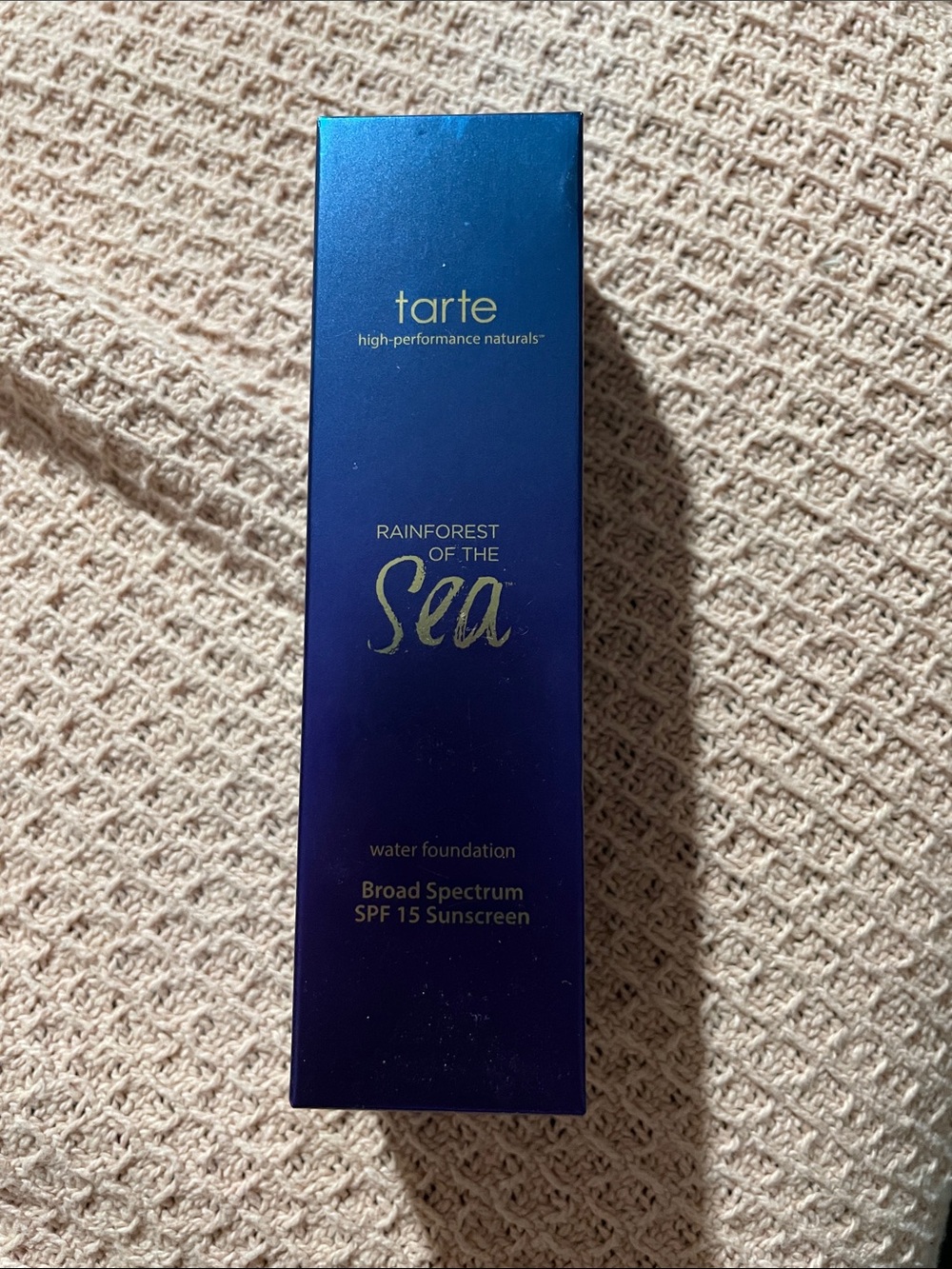 tarte Rainforest of the Sea Water Foundation - metallic blue and gold